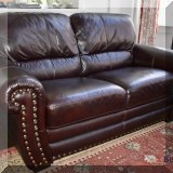F01. Lane Furniture leather nailhead loveseat. 36”h x 66”w x 37”d 